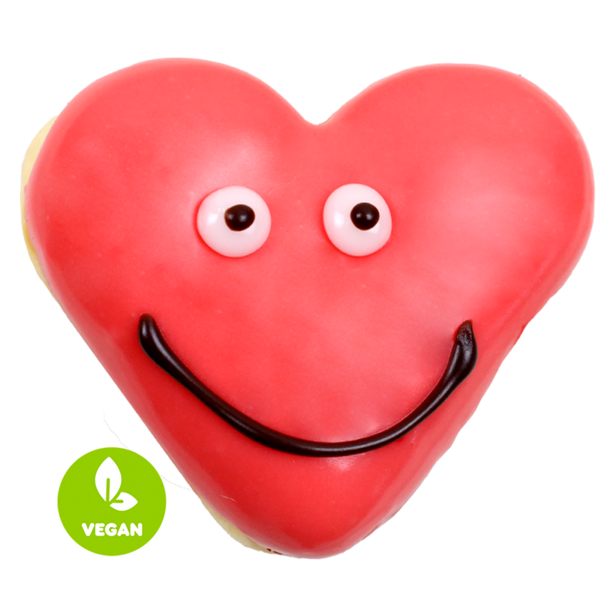 Ein rotes, herzförmiges Gebäck mit Augen und einem lächelnden Mund, gekennzeichnet mit „VEGAN“.